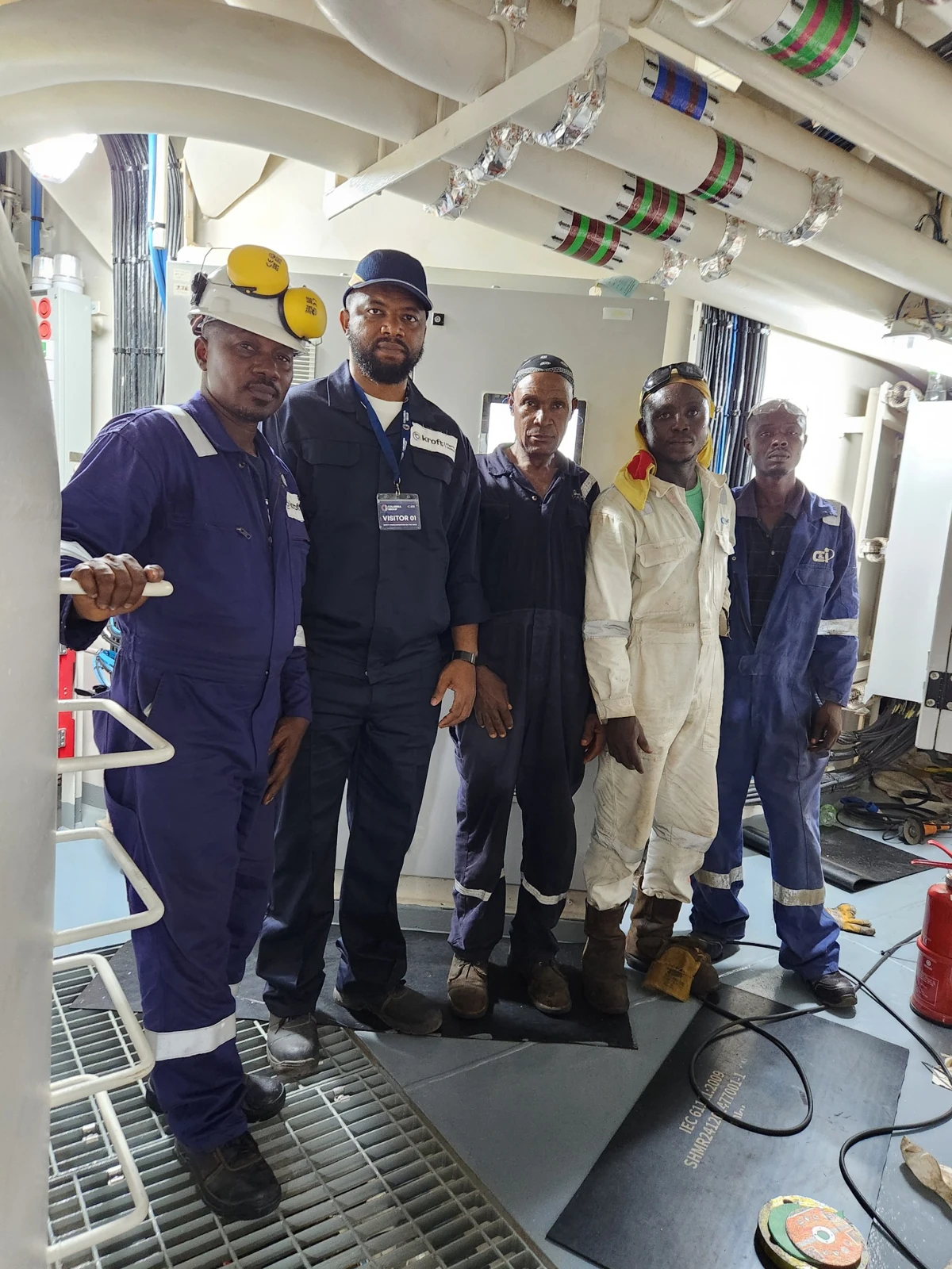 Members of the Kroft team in a vessel machinery space